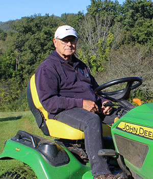 Midshot of Bob Kurcoba sitting on a tractor.