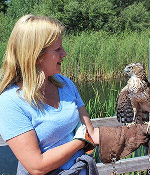 Headshot of Elaine Smith holding a Cooper's Hawk.