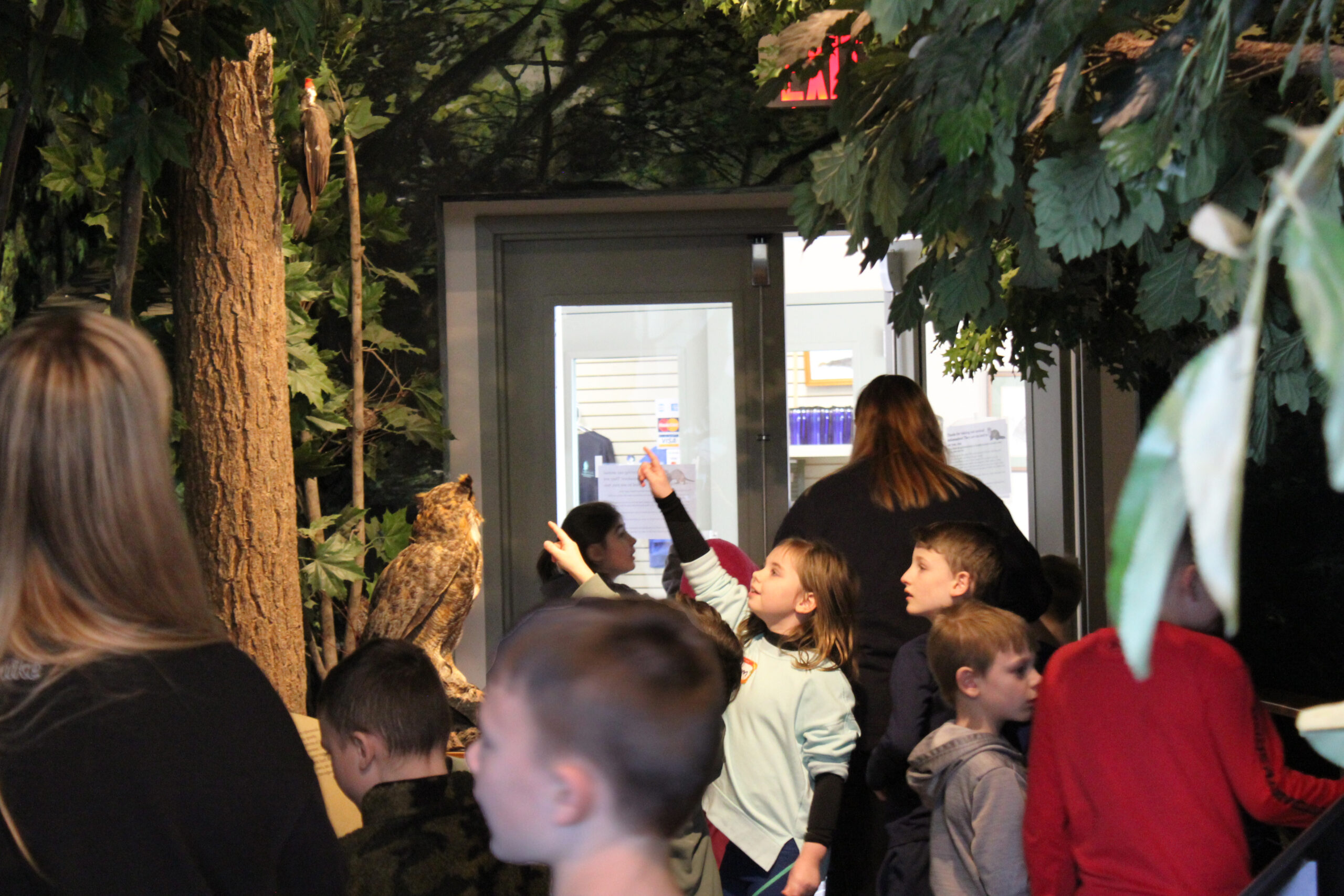 Group photo of children exploring the exhibit hall.